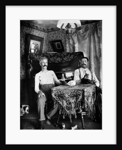 1890s Two Men In Shirt Sleeves Sitting At Table Drinking Bottles Of Beer With Piano And Dog by Anonymous