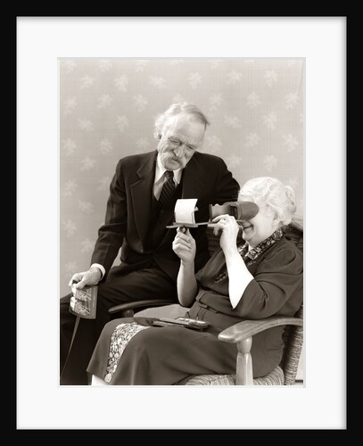 1940s Older Senior Couple Man Woman Viewing Photographs By Stereopticon Stereoscope by Anonymous