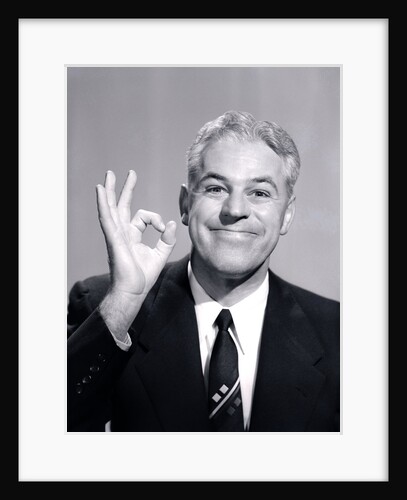 1950s Portrait Of Happy Man Businessman Slesman Making An Ok Hand Sign by Anonymous