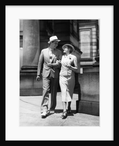 1930s Couple In Suits And Hats Walking Arm In Arm by Anonymous