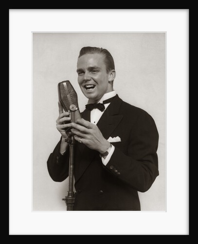 1920s 1930s Man Radio Singer Entertainer Crooner In Tuxedo Singing Into Microphone by Anonymous