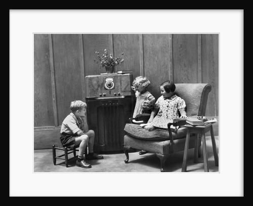 1930s Two Little Girls And A Boy Sitting In Living Room Listening To Radio by Anonymous