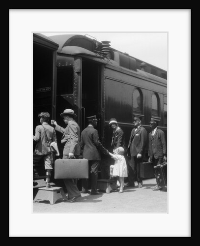 1920s Family Boarding Passenger Train Assisted By Trainman And Porters Carrying Luggage Outdoor by Anonymous