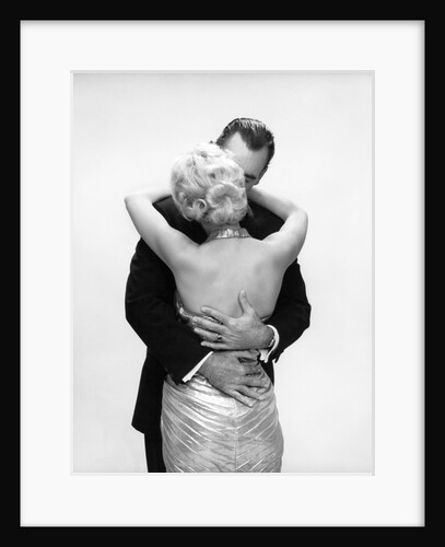 1950s 1960s Wife In Backless Satin Gown Evening Dress And Husband Embracing And Kissing by Anonymous