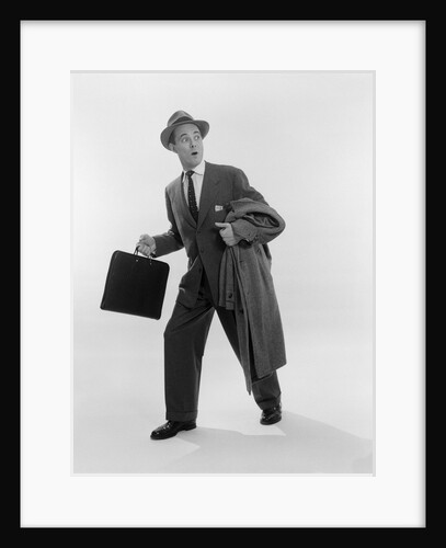 1950s Surprised Businessman Holding Briefcase Taking A Step Forward Looking Back by Anonymous