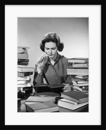 1950s 1960s College Woman Studying Surrounded All Around By Piles Of Books by Anonymous