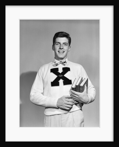 1940s 1950s Portrait Boy Student Carrying Books Wearing Football Letter Sweater by Anonymous