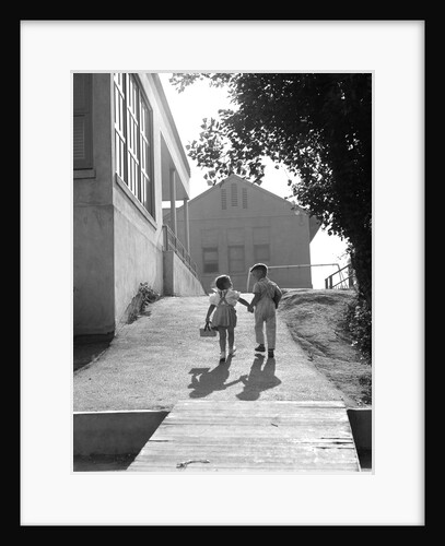1940s 1950s Two School Children Boy And Girl Walking To School Holding Hands by Anonymous