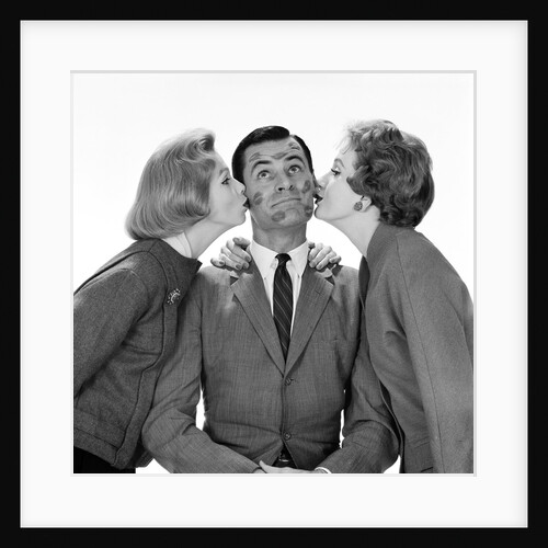 1950s Two Women Kissing Single Man On Opposite Cheeks His Face Covered With Lipstick Marks by Anonymous