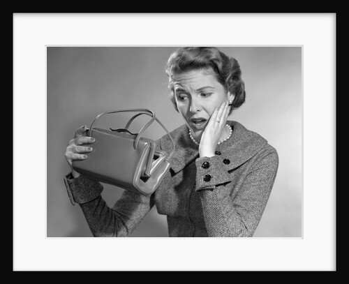 1950s Woman With Exaggerated Expression Hand On Face Looking Inside Her Purse by Anonymous