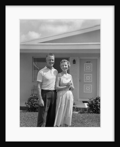 1950s Older Man Woman Senior Citizen Standing Together In Retirement Home Front Yard by Anonymous