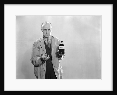 1930s Dour Man In Lab Coat Holding Bottle Of Poison by Anonymous