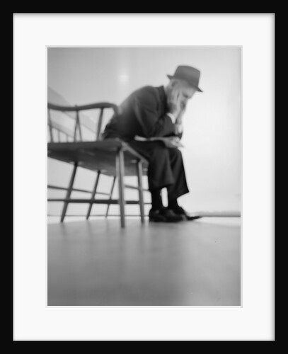1960s Depressed Elderly Man Sitting On Bench Leaning Forward Elbows On Knees Head In Hands by Anonymous