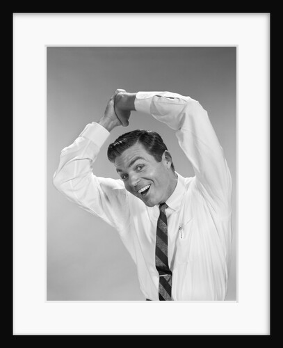 1960s Businessman In Shirtsleeves Clasping Hands Together Overhead by Anonymous
