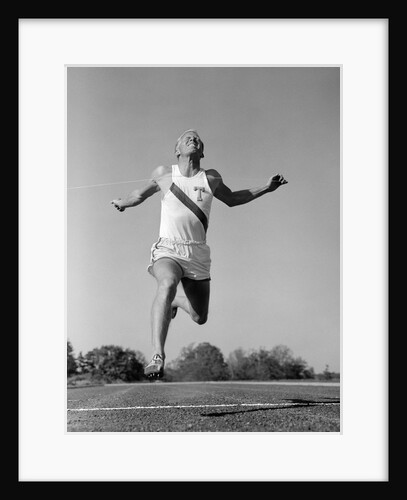 1960s Man Running Winning Sprinting Across The Finish Line Outdoor by Anonymous