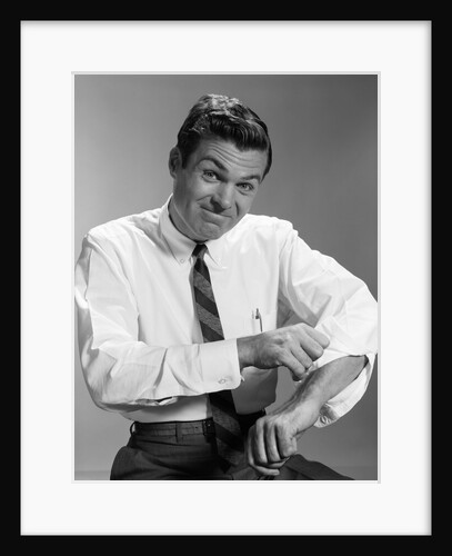 1960s Man In Business Shirt And Tie Rolling Up His Sleeves To Work Determined Look Studio by Anonymous