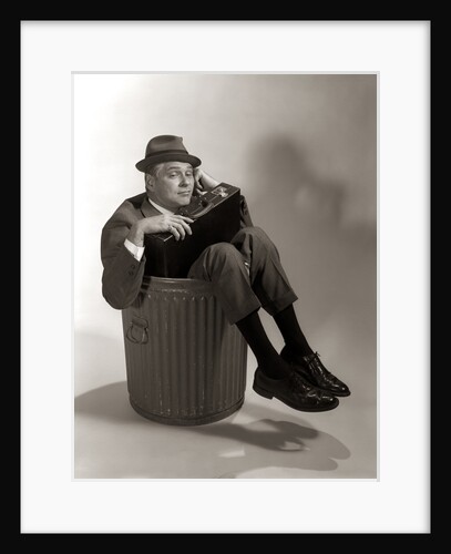 1960s Fired Businessman Sitting In Trash Can by Anonymous