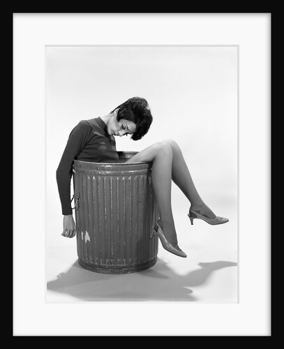 1960s Young Woman In Trash Can by Anonymous