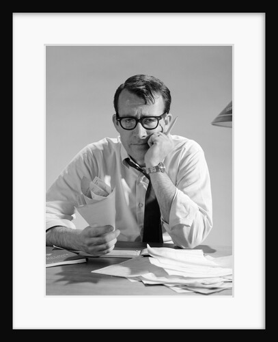 1960s Man With Pile Of Bills And Worried Expression by Anonymous