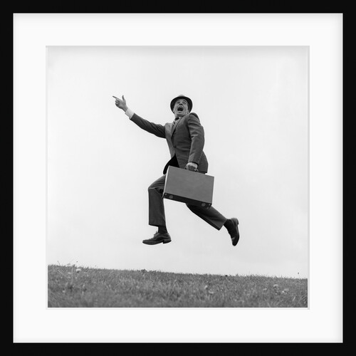 1960s Businessman Carrying A Briefcase Running Yelling And Jumping In The Air by Anonymous