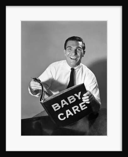1960s Man Father Holding Baby Care Book by Anonymous