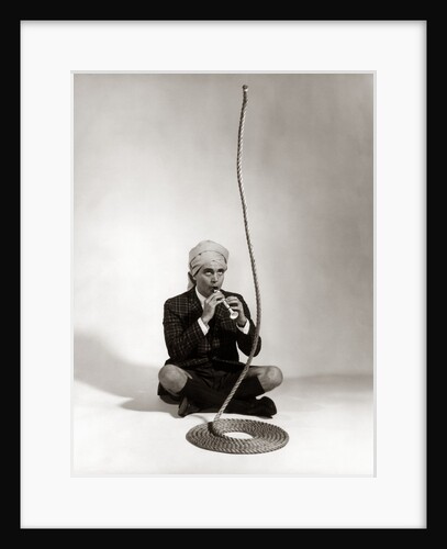 1960s Man Snake Charmer Character In Turban Plaid Jacket Shorts Knee Socks by Anonymous