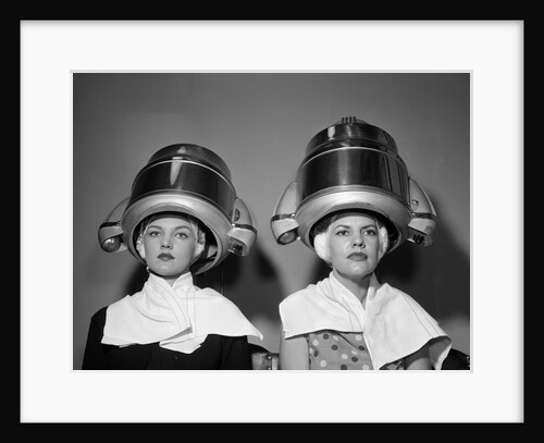 1950s Two Women Under Hair Dryers Towels Around Shoulders Hair Nets by Anonymous