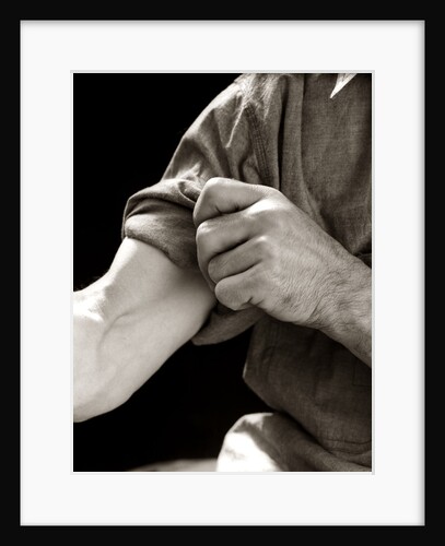 1920s 1930s 1940s 1950s Man Rolling Up Sleeve Symbolic Get To Work by Anonymous