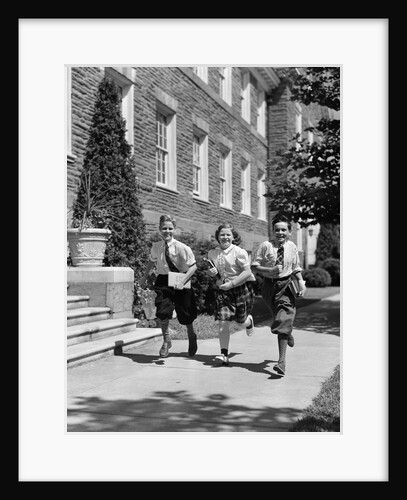 1940s Three School Children 2 Boys 1 Girl Running Down Sidewalk Carrying Books by Anonymous