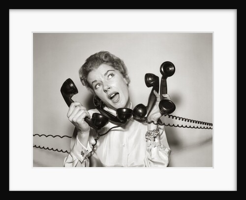 1950s 1960s Overwhelmed Stressed Woman Answering Four Black Telephone Phone Receivers At One Time by Anonymous