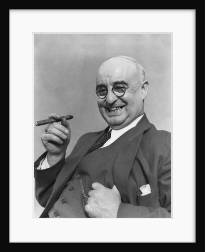 1930s Elderly Businessman In 3-Piece Suit and Glasses Leaning Back With Cigar In Hand by Anonymous