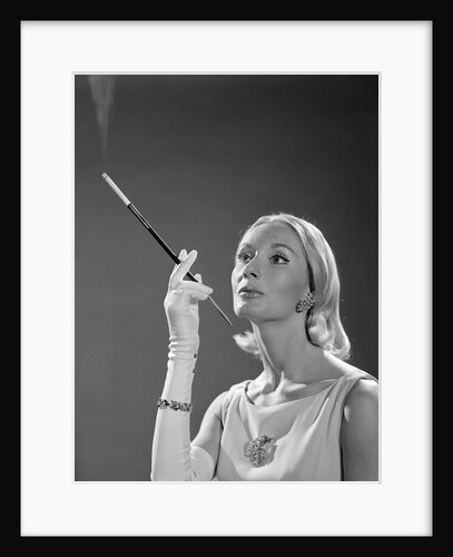 1960s Elegant Woman Wearing Gown With French Cigarette Holder by Anonymous