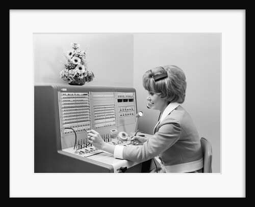 1970s Receptionist Working Answering Office Telephone Switchboard Wearing Headset by Anonymous