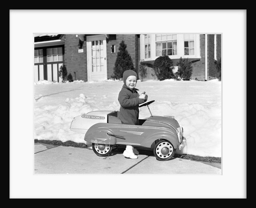 1930s 1940s Little Boy Playing In Toy Car Outside In Snow by Anonymous