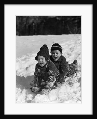 1930 1930s Boy And Girl Laughing Sledding In Snow by Anonymous