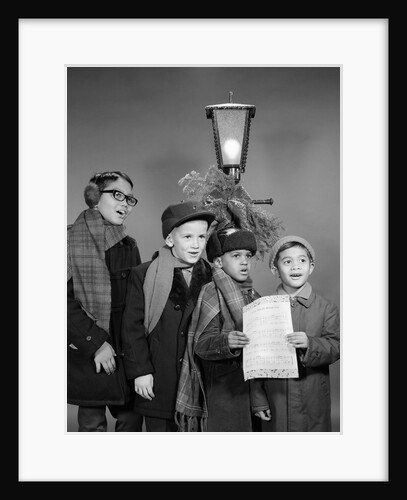 1960s Boys Singing Christmas Carol Together Standing By Outdoor Porch Light by Anonymous