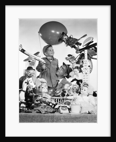 1950s Father With Son Holding Balloon Surrounded By Toys and Stuffed Animals by Anonymous