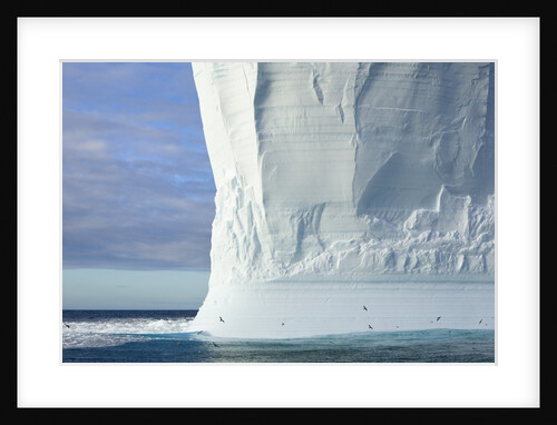 Massive Tabular Iceberg Sculpted by Waves by Anonymous
