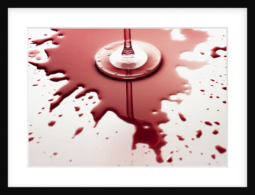 Red wine spilled around glass by Anonymous