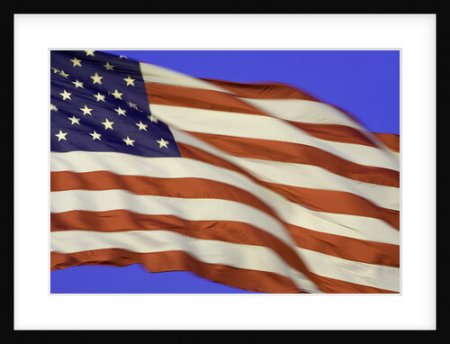 American flag unfurled by strong wind