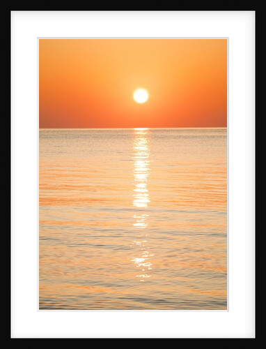 Sunlight reflecting on ocean at sunset by Anonymous