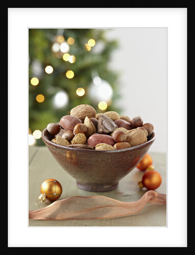 Bowl of nuts by holiday decorations