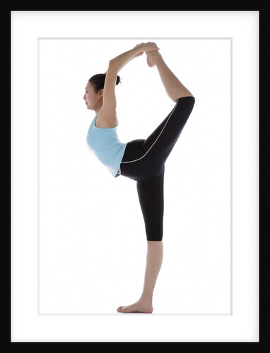 Female gymnast standing on one leg, holding other foot behind her head by Anonymous