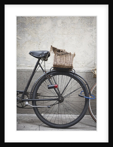 Bicycle with weathered basket by Anonymous