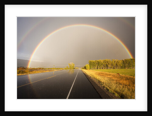 Double rainbow on country road in autumn by Anonymous