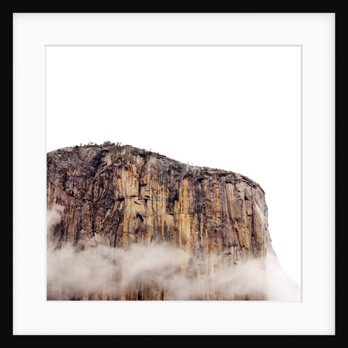 Sheer cliff rising above clouds by Anonymous