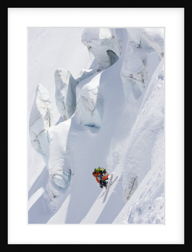 Backcountry skier in mid-jump by Anonymous
