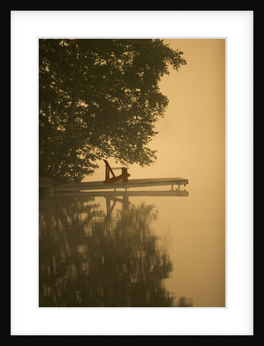 Adirondack chair on dock by Anonymous
