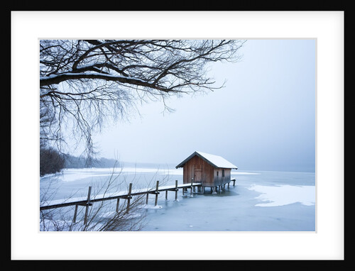 Snow covered pier and boat house at Lake Starnberg by Anonymous