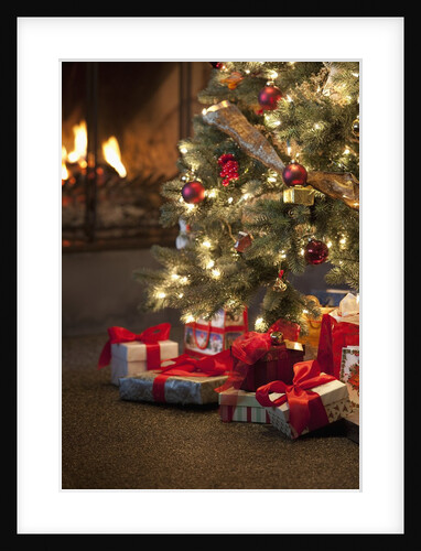Christmas tree by fireplace by Anonymous